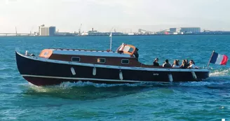 Tour de la baie sur un bateau traditionnel à moteur - Kapalouest Tour de la baie sur un bateau traditionnel à moteur - Kapalouest